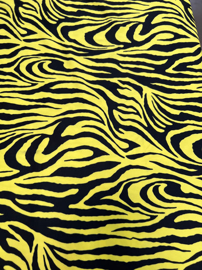 Exotic Zebra design yellow/black print on great quality of poly spandex 4-way stretch 58/60” Sold by the YD. Ships Worldwide from L.A CA