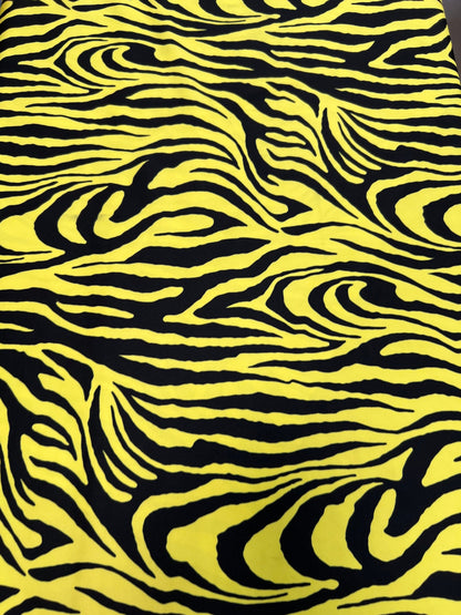 Exotic Zebra design yellow/black print on great quality of poly spandex 4-way stretch 58/60” Sold by the YD. Ships Worldwide from L.A CA