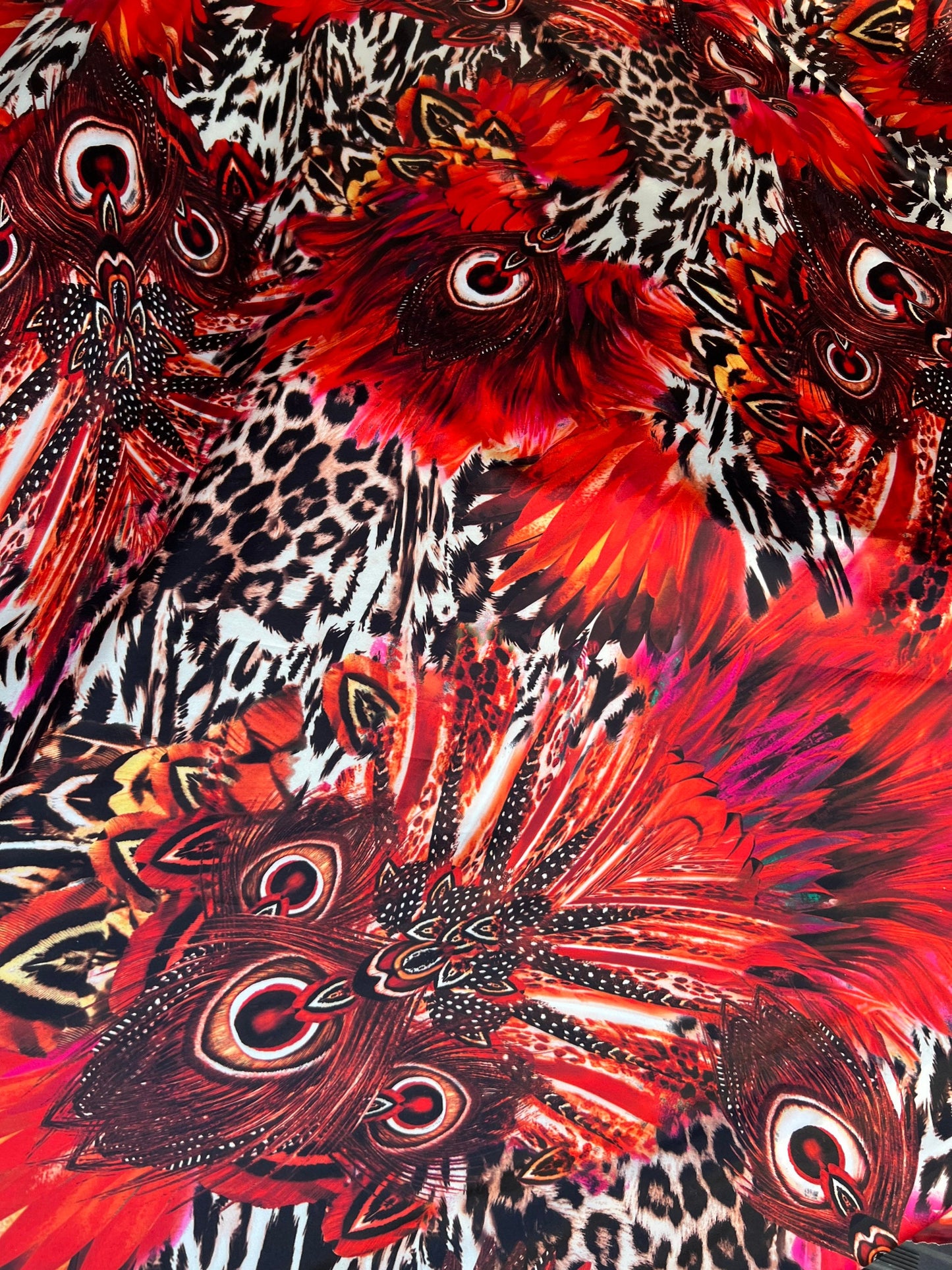 Hiding Leopard & Peacock design exotic animal print on yoga poly spandex 4-way stretch 58/60” Sold by the YD. Ships Worldwide