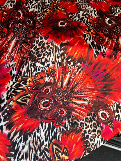Hiding Leopard & Peacock design exotic animal print on yoga poly spandex 4-way stretch 58/60” Sold by the YD. Ships Worldwide