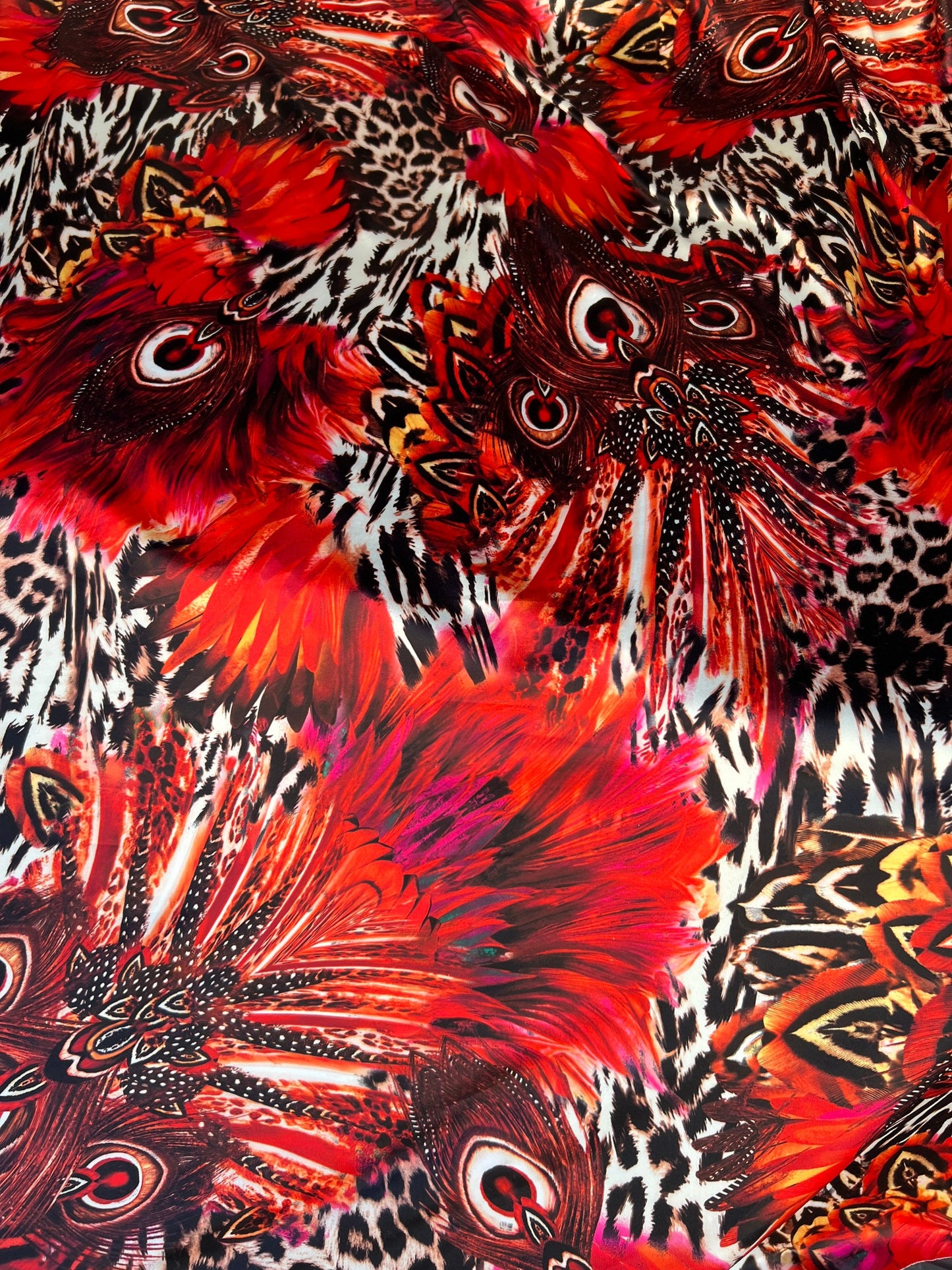 Hiding Leopard & Peacock design exotic animal print on yoga poly spandex 4-way stretch 58/60” Sold by the YD. Ships Worldwide