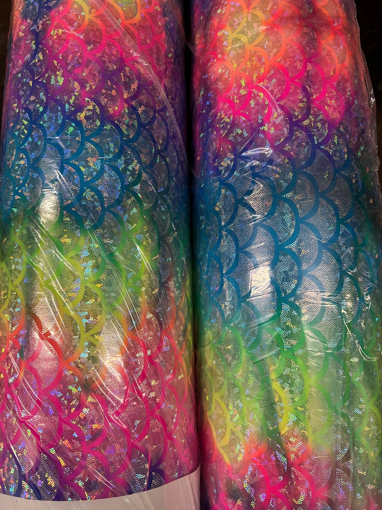 Rainbow mermaid design hologram metallic Nylon spandex 4-way stretch 58/60” Sold by the YD.