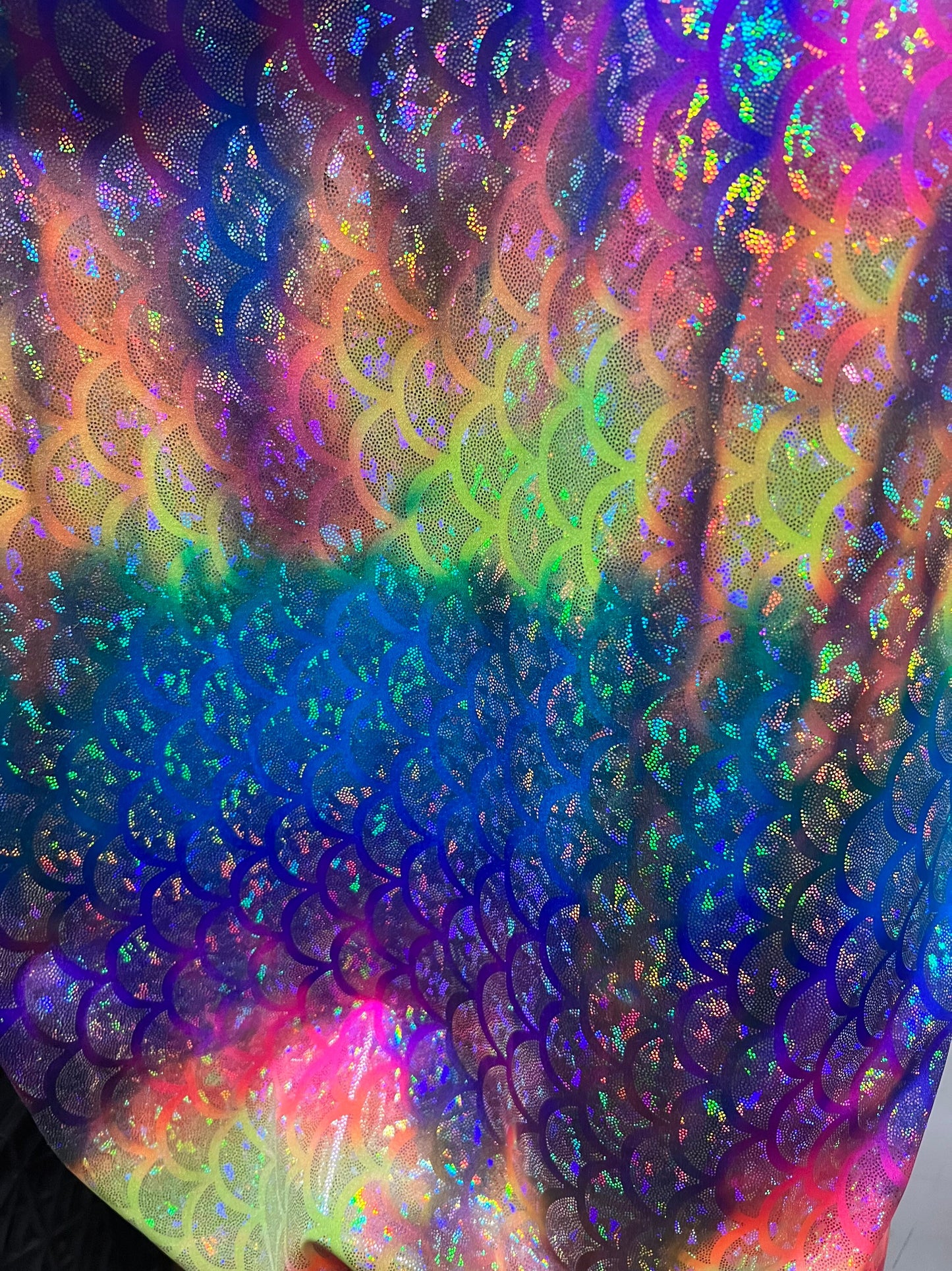 Rainbow mermaid design hologram metallic Nylon spandex 4-way stretch 58/60” Sold by the YD.