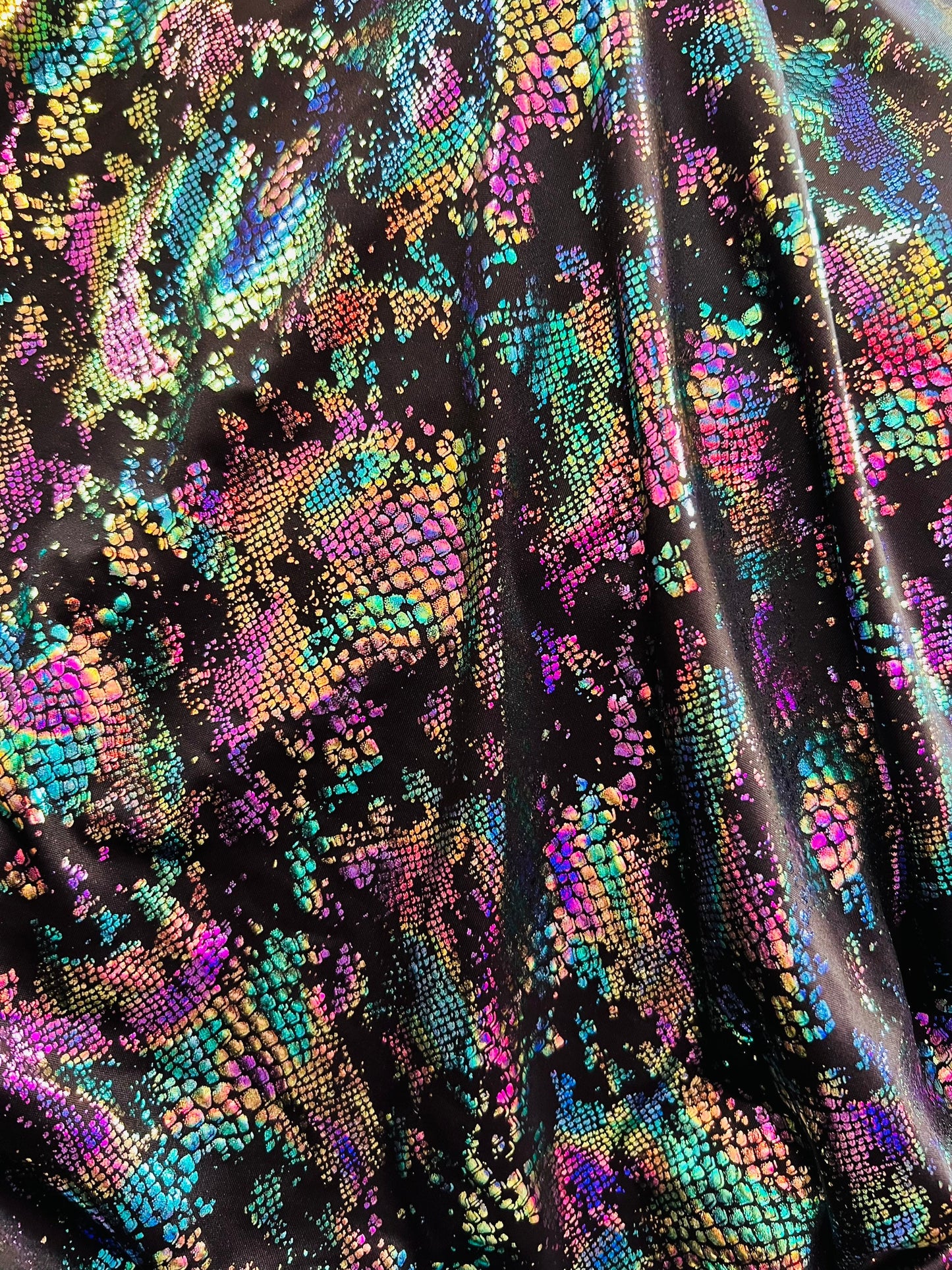 New snake design metallic Poly spandex 2-way stretch 58/60” Sold by the YD. Ships worldwide from Los Angeles California USA.