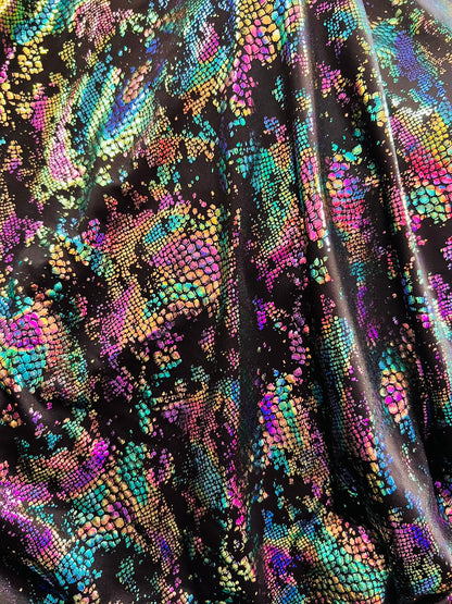 New snake design metallic Poly spandex 2-way stretch 58/60” Sold by the YD. Ships worldwide from Los Angeles California USA.
