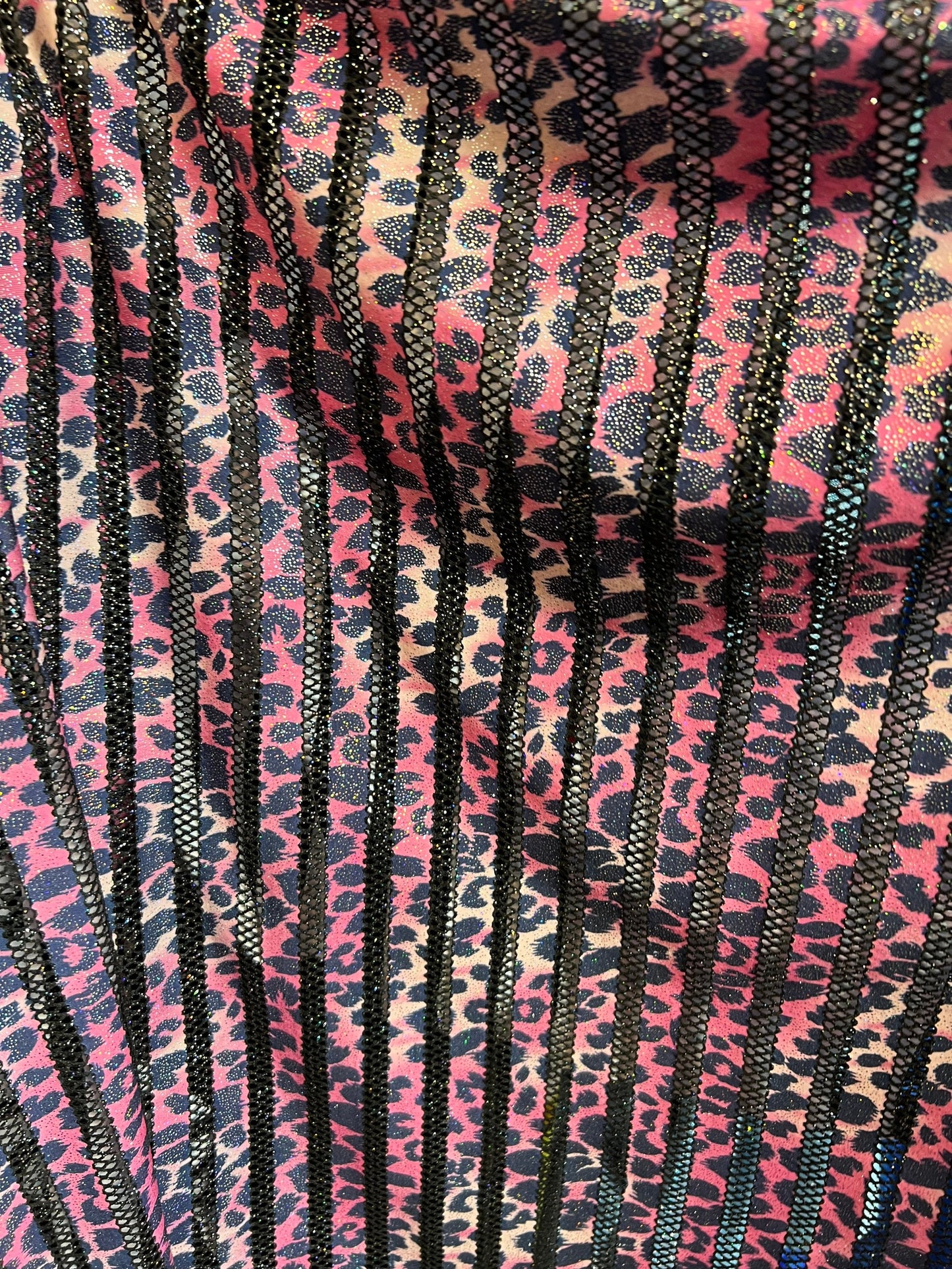 Exotic Leopard design print on nylon fish net with metallic glitter 4-way stretch 58/60” Sold by the YD. Ships Worldwide from Los Angeles CA