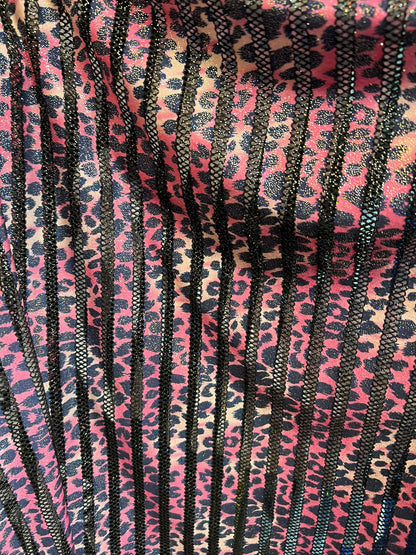 Exotic Leopard design print on nylon fish net with metallic glitter 4-way stretch 58/60” Sold by the YD. Ships Worldwide from Los Angeles CA