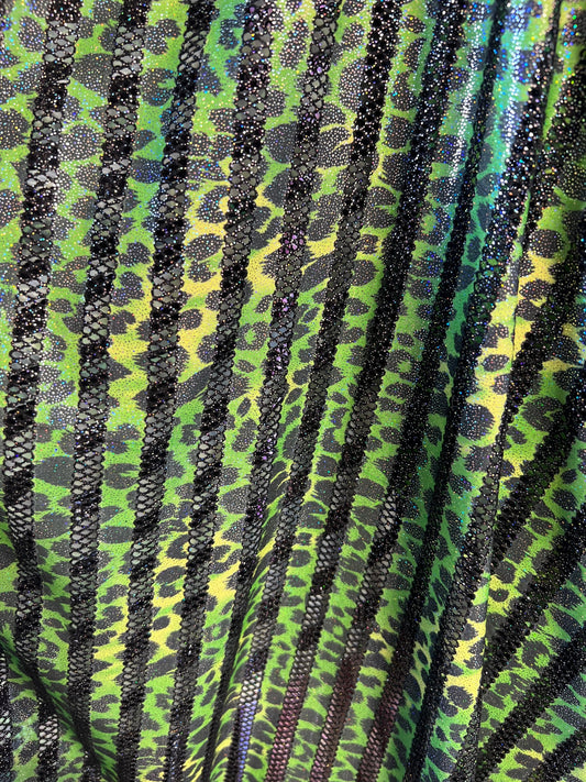 Exotic Leopard design print on nylon fish net with metallic glitter 4-way stretch 58/60” Sold by the YD. Ships Worldwide from Los Angeles CA