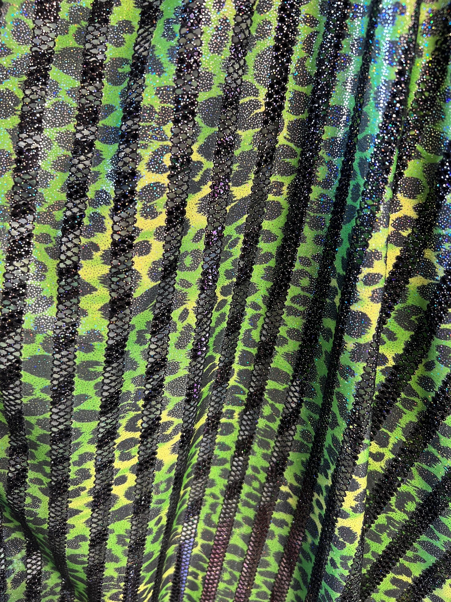 Exotic Leopard design print on nylon fish net with metallic glitter 4-way stretch 58/60” Sold by the YD. Ships Worldwide from Los Angeles CA
