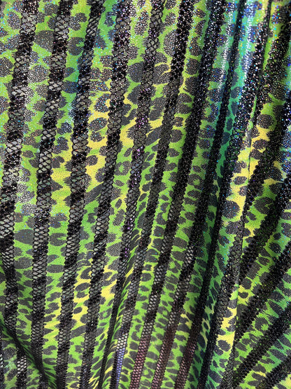 Exotic Leopard design print on nylon fish net with metallic glitter 4-way stretch 58/60” Sold by the YD. Ships Worldwide from Los Angeles CA