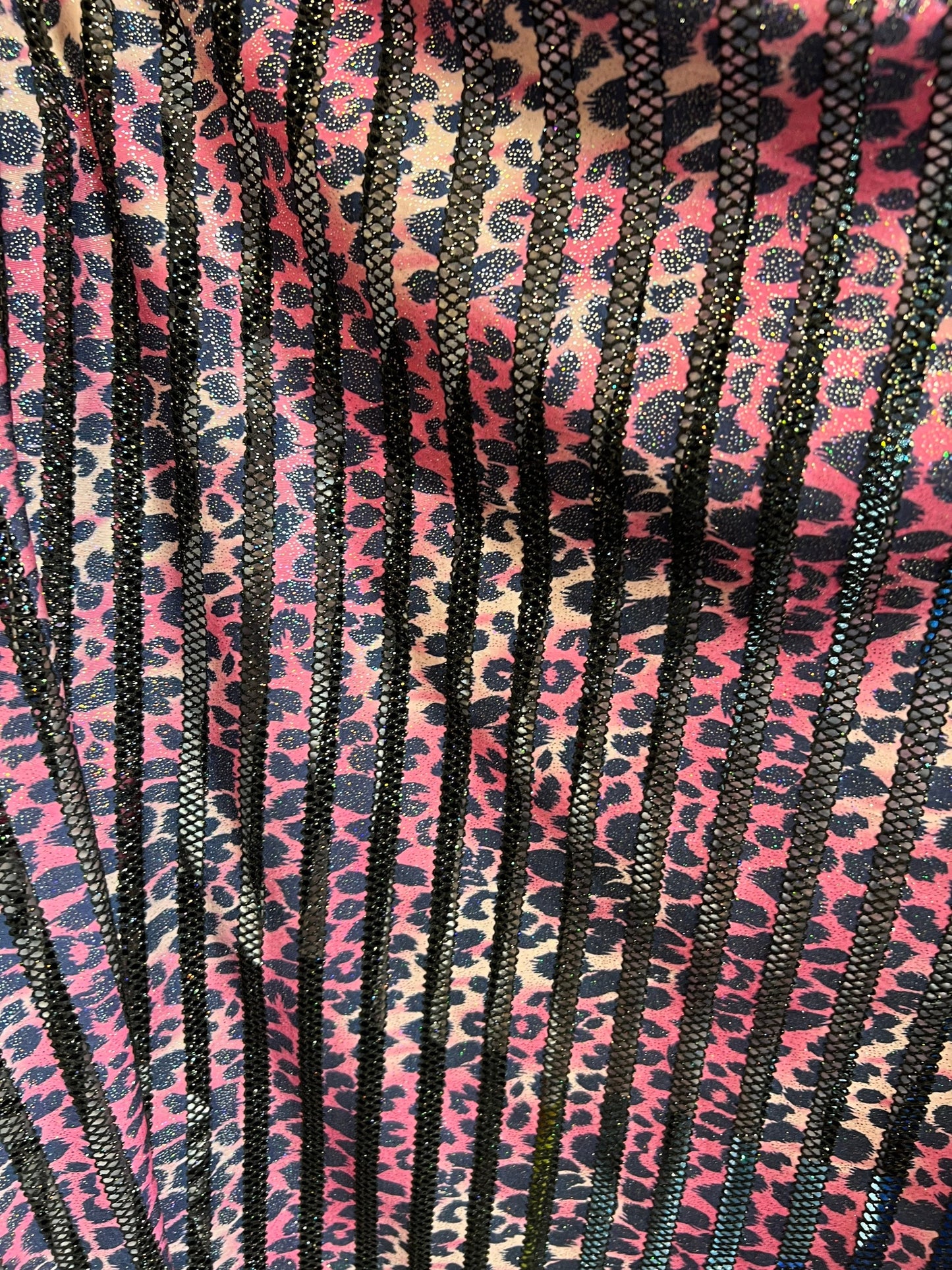 Exotic Leopard design print on nylon fish net with metallic glitter 4-way stretch 58/60” Sold by the YD. Ships Worldwide from Los Angeles CA