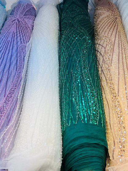 New Jennifer design beaded lace luxury design embroidered on stretch mesh 2-way 55/57” Sold by the YD. Ships Worldwide from Los Angeles Cali