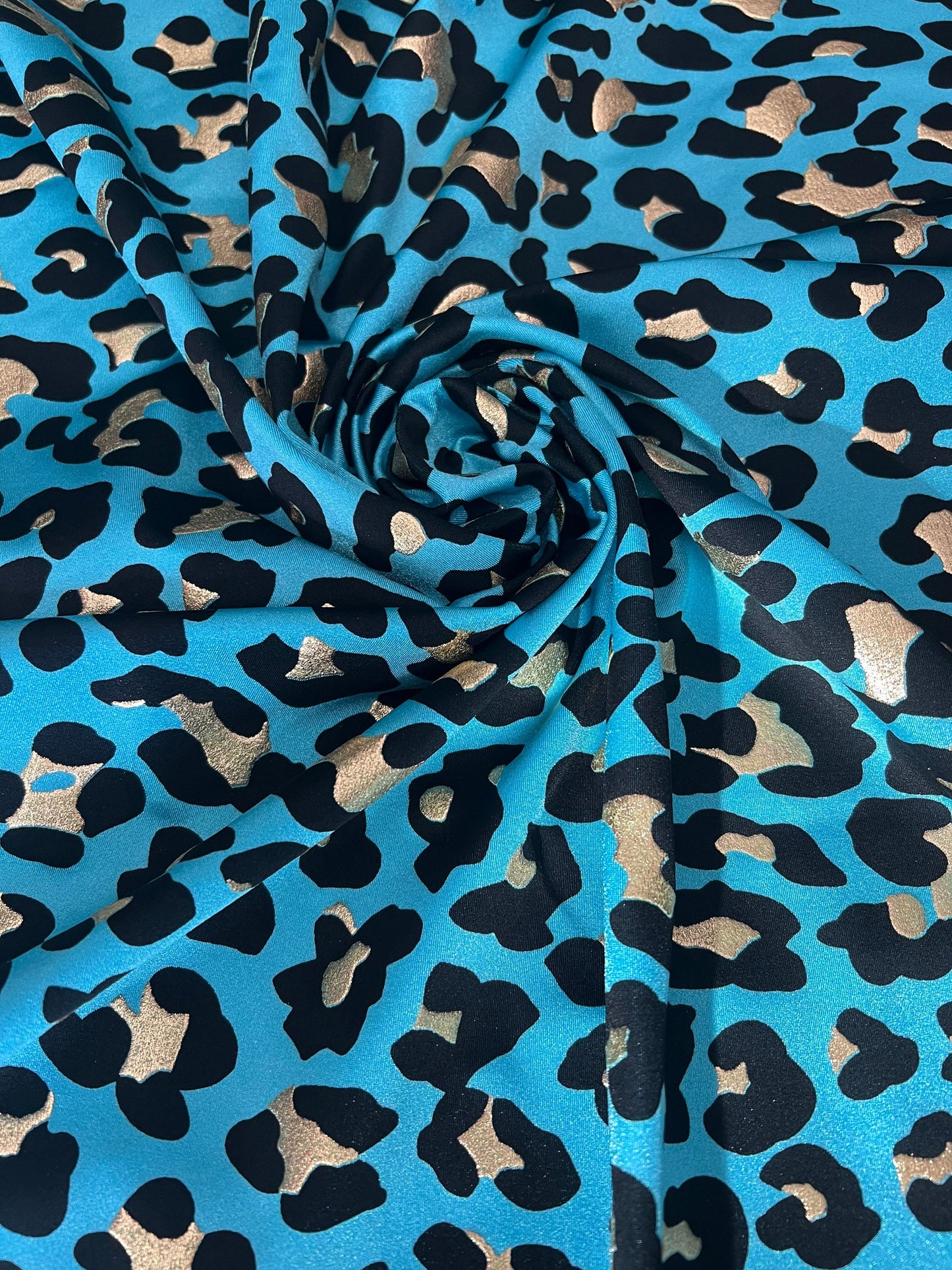 New Exotic Leopard design metallic nylon spandex 4-way stretch it glows in the dark 58/60” Sold by the YD. Ships worldwide from Los Angeles