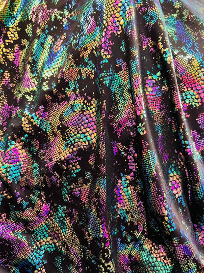New snake design metallic Poly spandex 2-way stretch 58/60” Sold by the YD. Ships worldwide from Los Angeles California USA.