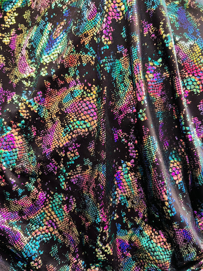 New snake design metallic Poly spandex 2-way stretch 58/60” Sold by the YD. Ships worldwide from Los Angeles California USA.