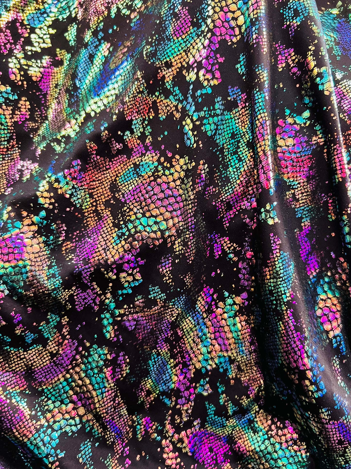 New snake design metallic Poly spandex 2-way stretch 58/60” Sold by the YD. Ships worldwide from Los Angeles California USA.
