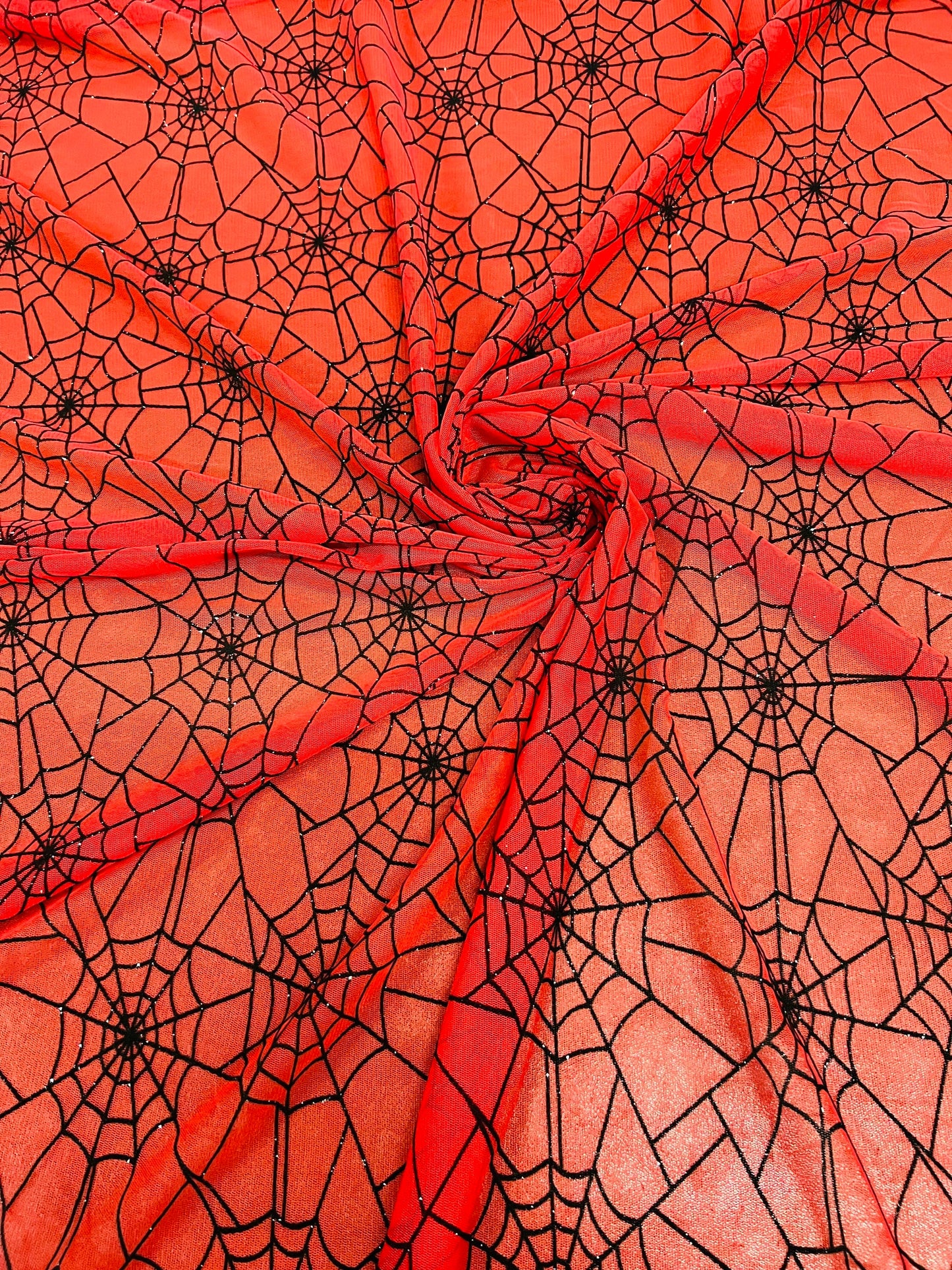 Spiderweb design red/black flocking stretch mesh 2-way stretch 58/60” Sold by the YD. Ships Worldwide from Los Ángeles California USA