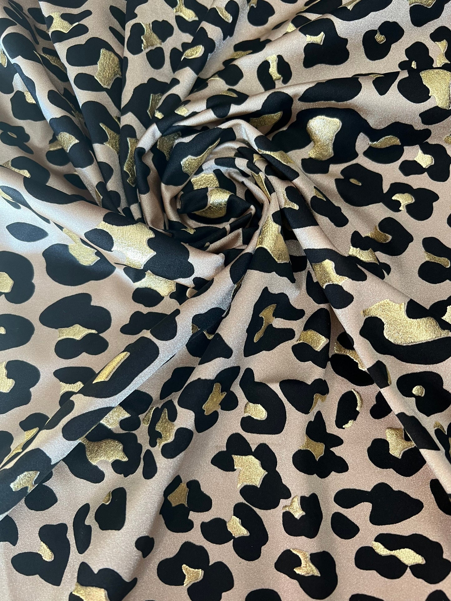 New Exotic Leopard design metallic nylon spandex 4-way stretch it glows in the dark 58/60” Sold by the YD. Ships worldwide from Los Angeles
