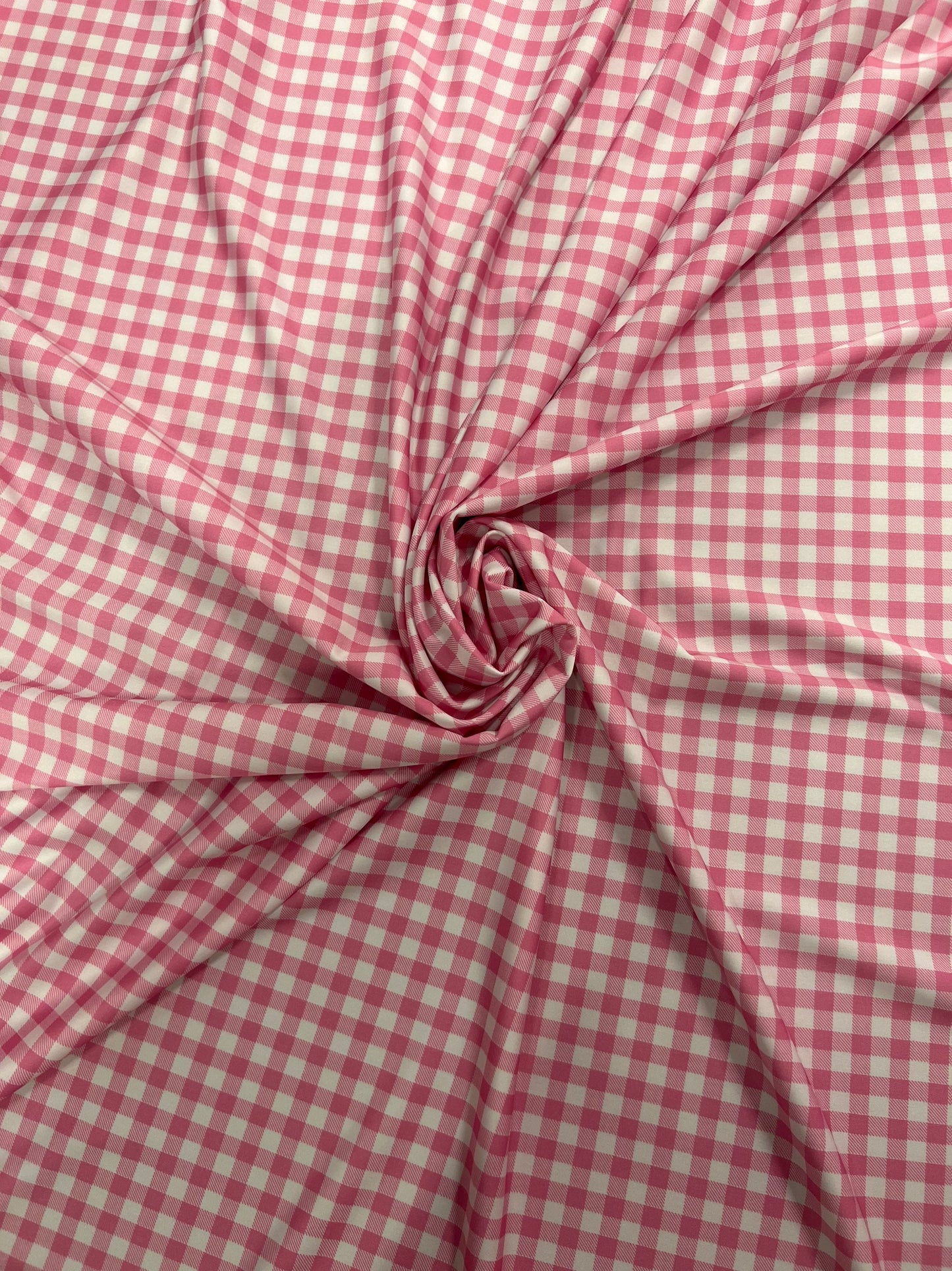 Gingham design pink Nylon spandex 4-way stretch 58/60”Sold by the YD. Ships Worldwide from Los Angeles California USA.