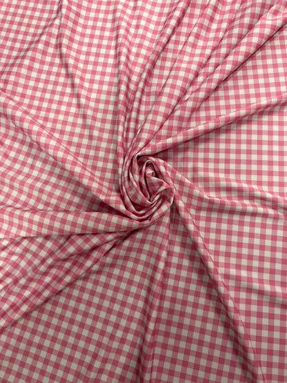 Gingham design pink Nylon spandex 4-way stretch 58/60”Sold by the YD. Ships Worldwide from Los Angeles California USA.