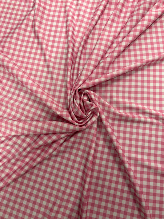 Gingham design pink Nylon spandex 4-way stretch 58/60”Sold by the YD. Ships Worldwide from Los Angeles California USA.