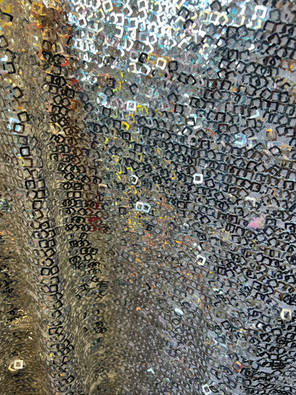 Geometric sequins design embroidered on stretch mesh 2-way 58/60” Sold by the YD. Ships Worldwide from Los Angeles California USA.