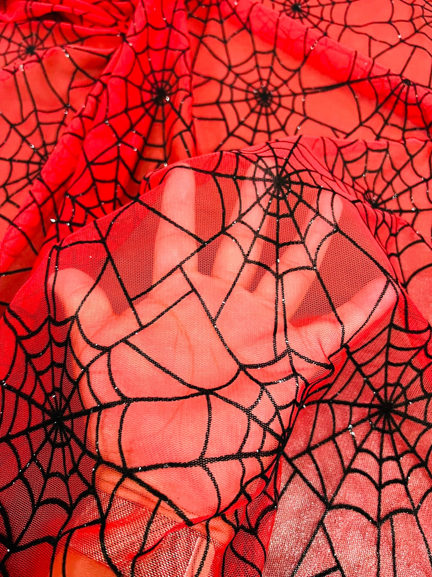 Spiderweb design red/black flocking stretch mesh 2-way stretch 58/60” Sold by the YD. Ships Worldwide from Los Ángeles California USA