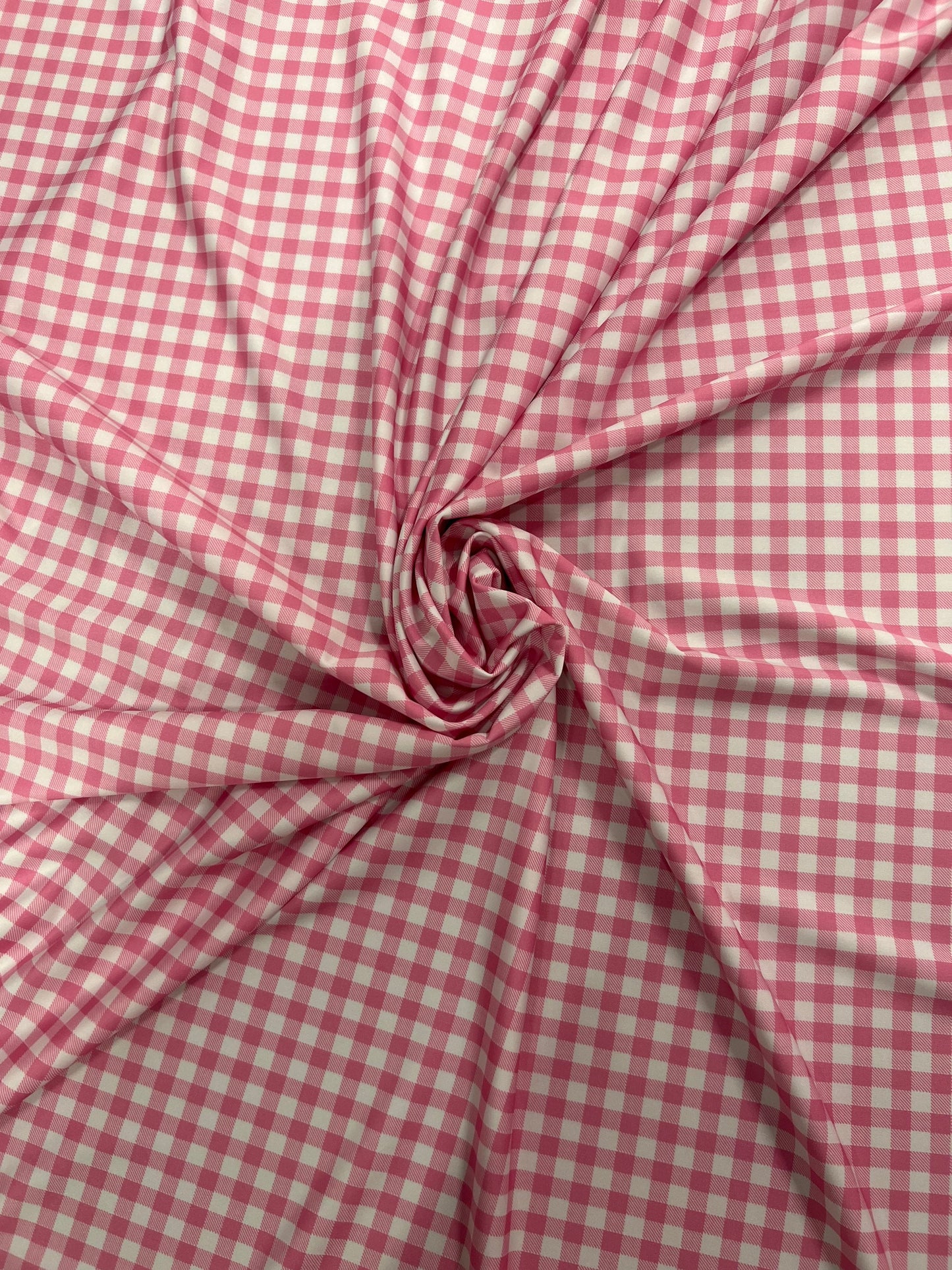 Gingham design pink Nylon spandex 4-way stretch 58/60”Sold by the YD. Ships Worldwide from Los Angeles California USA.