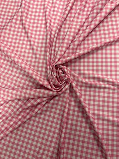 Gingham design pink Nylon spandex 4-way stretch 58/60”Sold by the YD. Ships Worldwide from Los Angeles California USA.