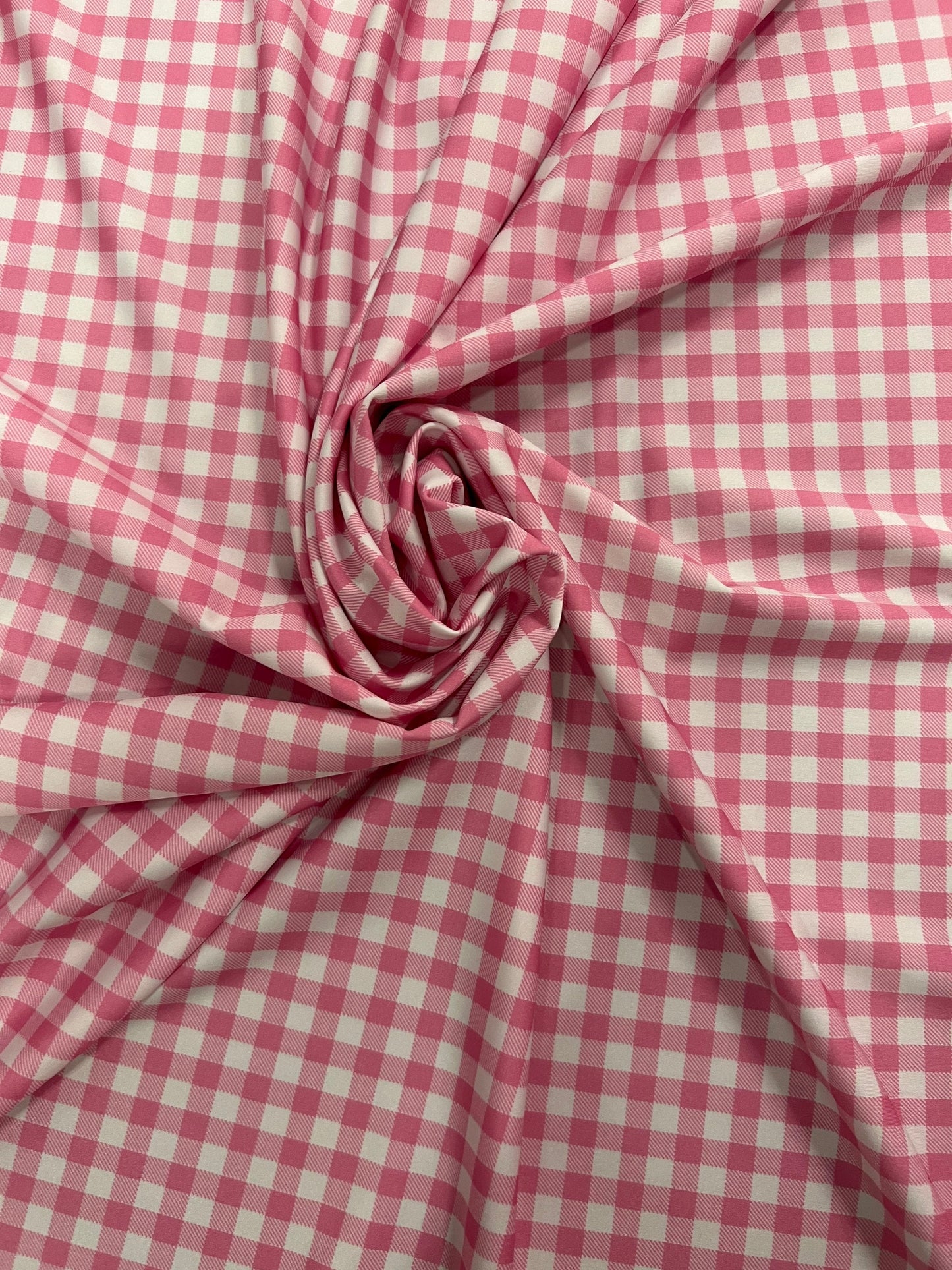 Gingham design pink Nylon spandex 4-way stretch 58/60”Sold by the YD. Ships Worldwide from Los Angeles California USA.