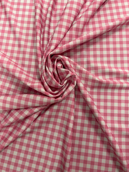 Gingham design pink Nylon spandex 4-way stretch 58/60”Sold by the YD. Ships Worldwide from Los Angeles California USA.