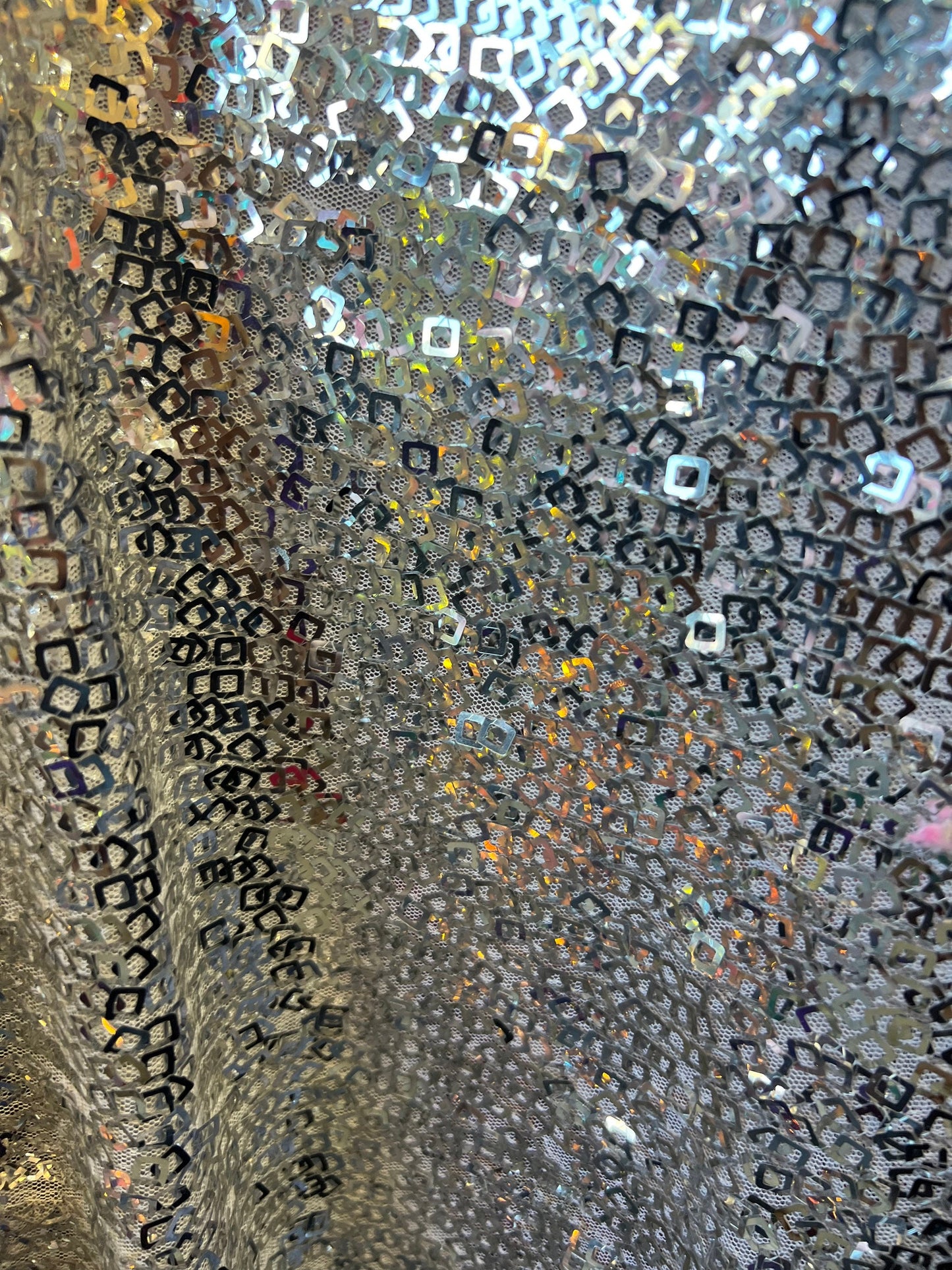 Geometric sequins design embroidered on stretch mesh 2-way 58/60” Sold by the YD. Ships Worldwide from Los Angeles California USA.
