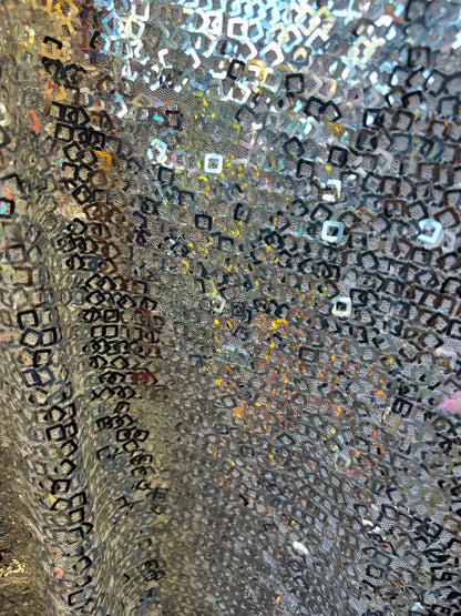 Geometric sequins design embroidered on stretch mesh 2-way 58/60” Sold by the YD. Ships Worldwide from Los Angeles California USA.