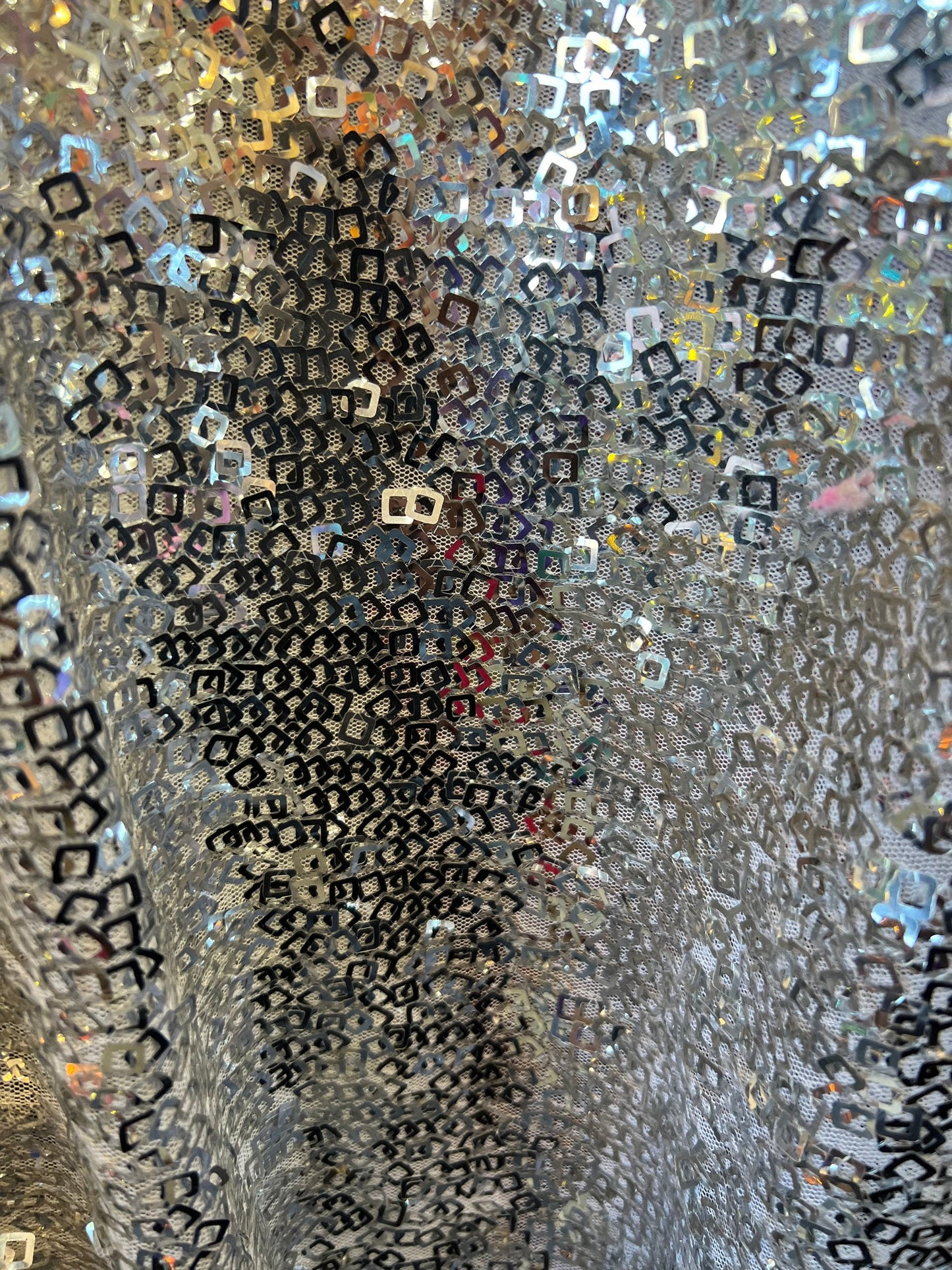 Geometric sequins design embroidered on stretch mesh 2-way 58/60” Sold by the YD. Ships Worldwide from Los Angeles California USA.