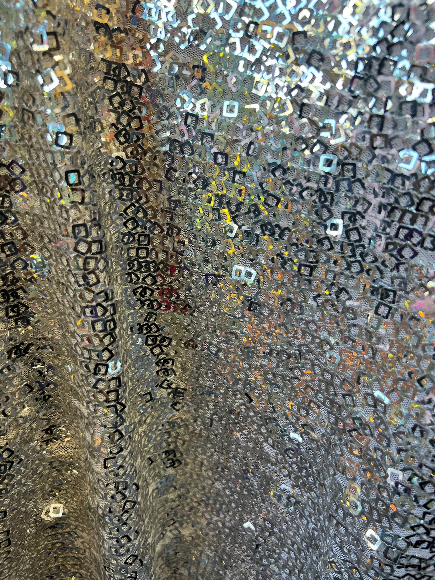 Geometric sequins design embroidered on stretch mesh 2-way 58/60” Sold by the YD. Ships Worldwide from Los Angeles California USA.