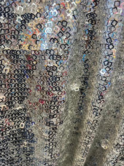 Geometric sequins design embroidered on stretch mesh 2-way 58/60” Sold by the YD. Ships Worldwide from Los Angeles California USA.