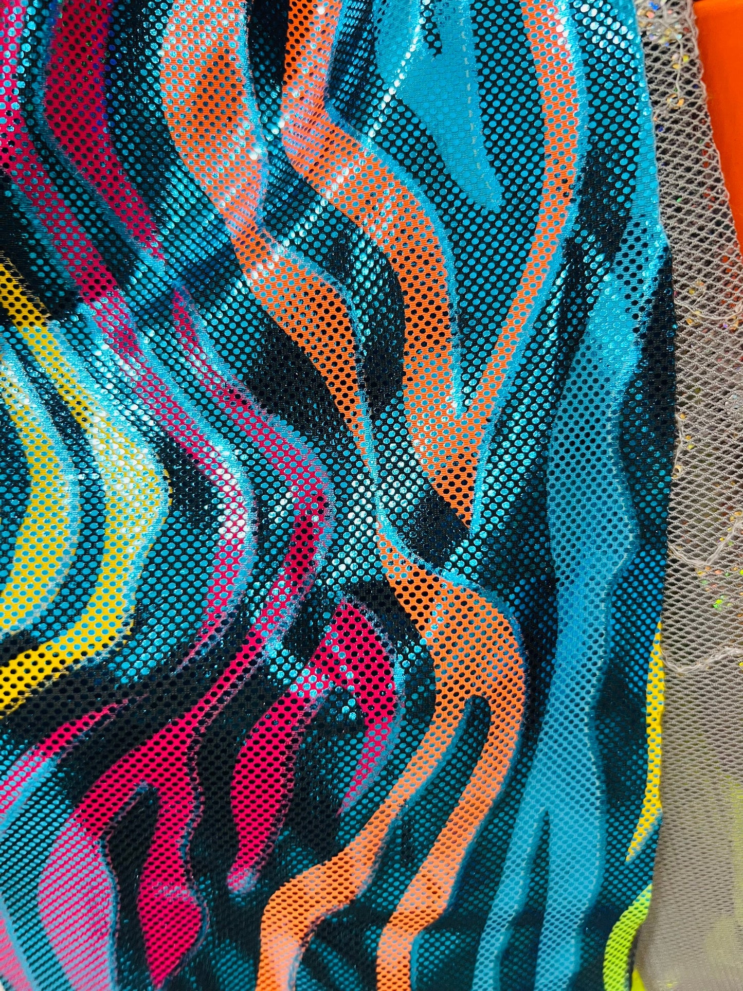 Rainbow zebra design hologram metallic Nylon spandex 4-way stretch 58/60” Sold by the YD. Ships worldwide from Los Angeles California USA
