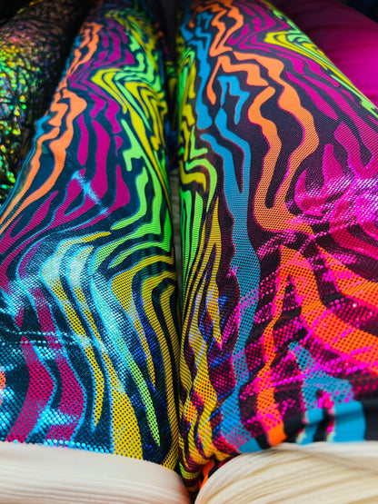 Rainbow zebra design hologram metallic Nylon spandex 4-way stretch 58/60” Sold by the YD. Ships worldwide from Los Angeles California USA