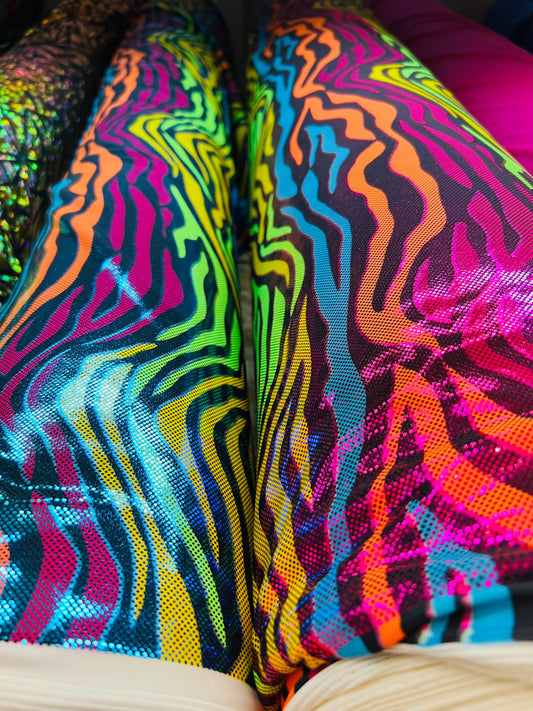 Rainbow zebra design hologram metallic Nylon spandex 4-way stretch 58/60” Sold by the YD. Ships worldwide from Los Angeles California USA