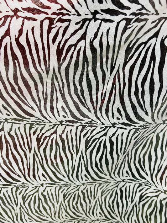 Exotic zebra design metallic nylon spandex with all over foil 4-way stretch 58/60” Sold by the YD. Ships worldwide from Los Angeles