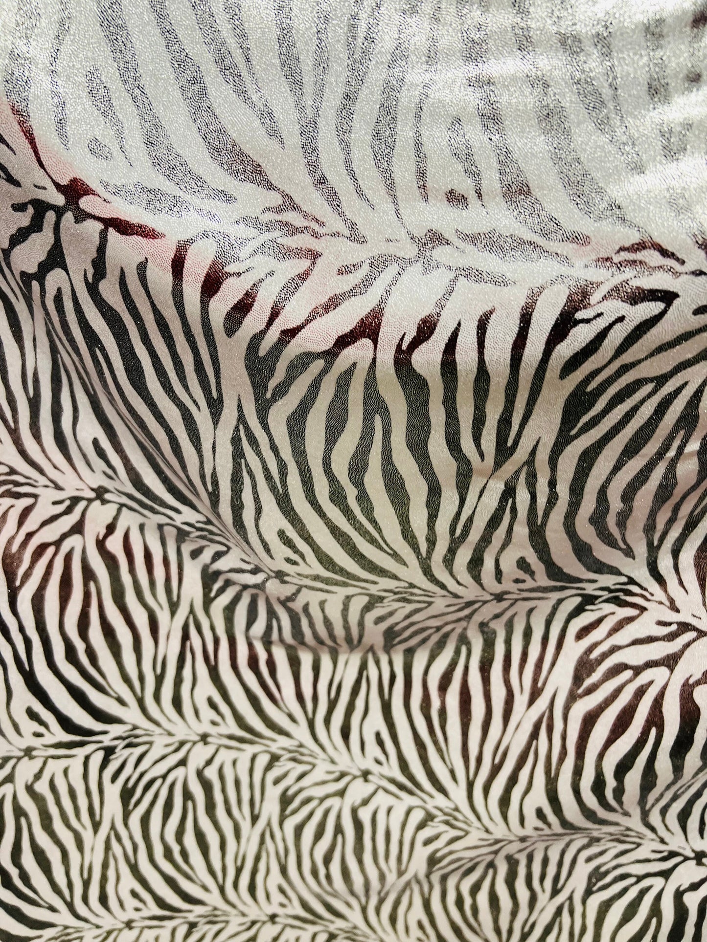 Exotic zebra design metallic nylon spandex with all over foil 4-way stretch 58/60” Sold by the YD. Ships worldwide from Los Angeles