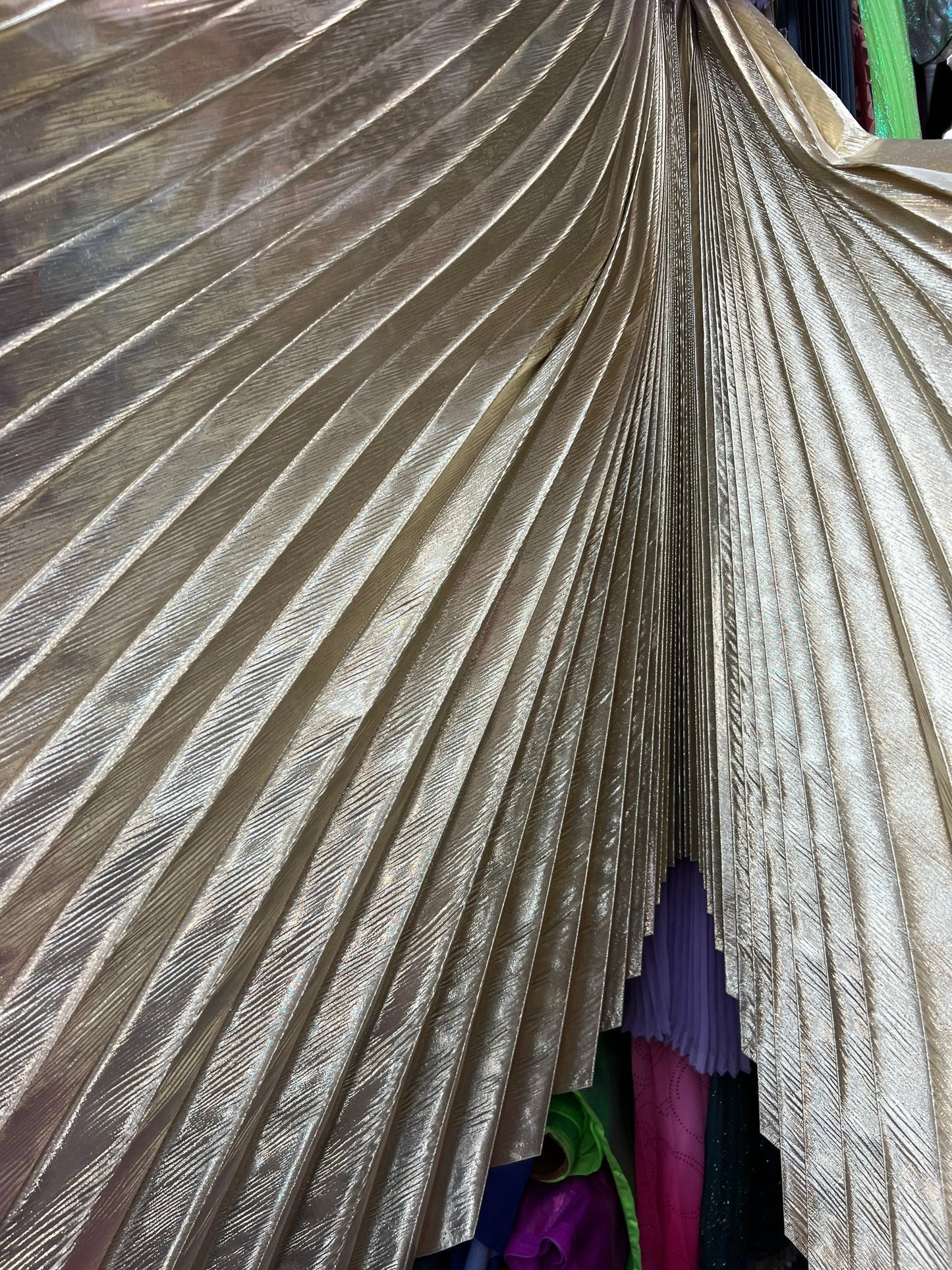 Sunburst pleated metallic lame non stretch 108” length by 45” width Sold by the PC. Ships worldwide from Los Angeles California USA
