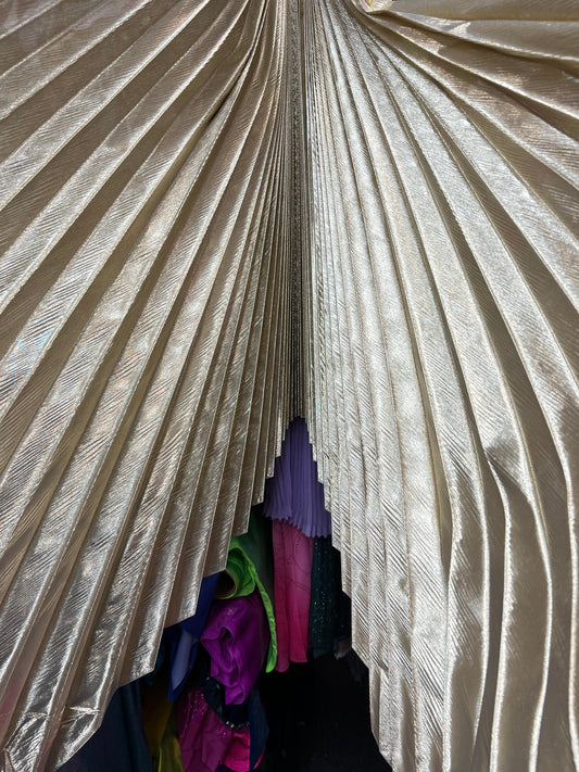 Sunburst pleated metallic lame non stretch 108” length by 45” width Sold by the PC. Ships worldwide from Los Angeles California USA