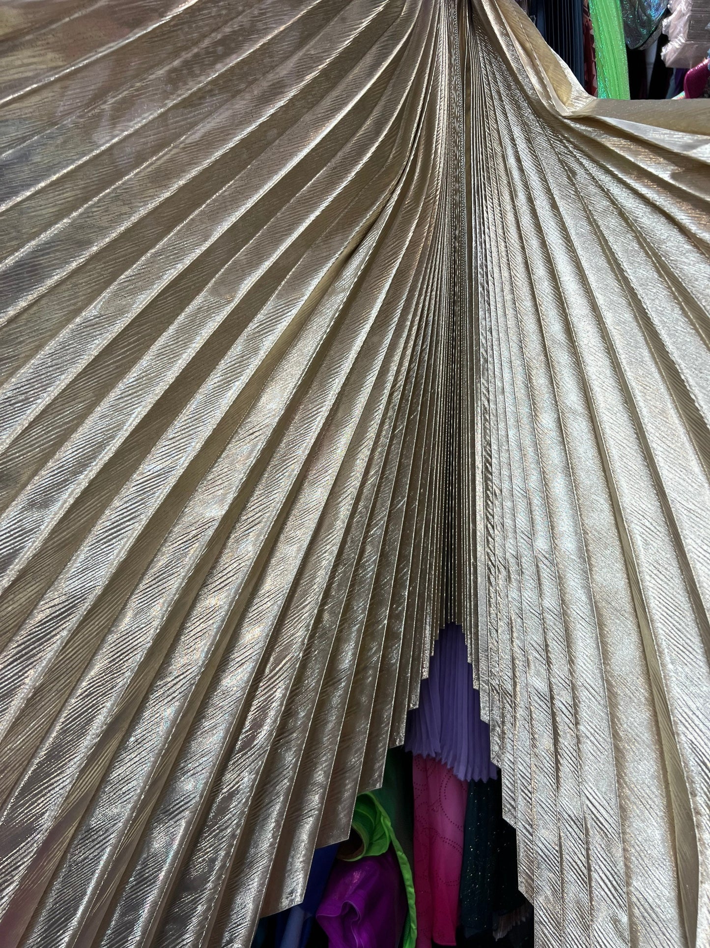 Sunburst pleated metallic lame non stretch 108” length by 45” width Sold by the PC. Ships worldwide from Los Angeles California USA