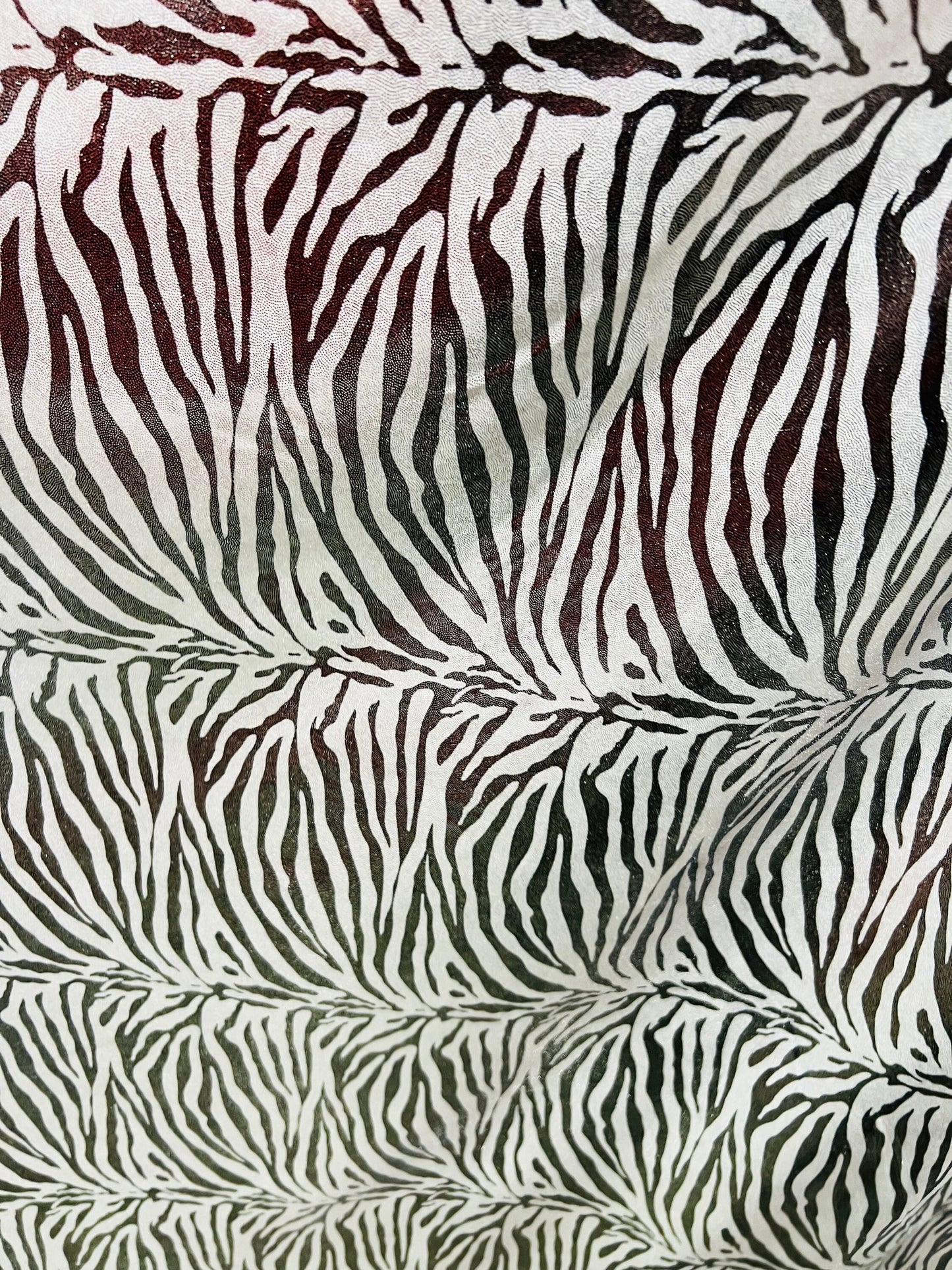 Exotic zebra design metallic nylon spandex with all over foil 4-way stretch 58/60” Sold by the YD. Ships worldwide from Los Angeles