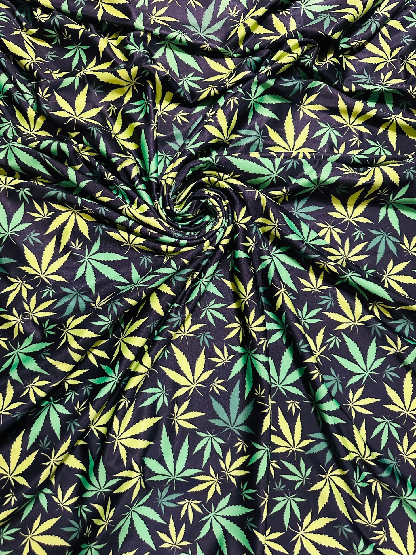 Marihuana leaf design Green/Yellow print on great quality of nylon spandex 4-way stretch 58/60” Sold by the YD. Ships worldwide from L.A