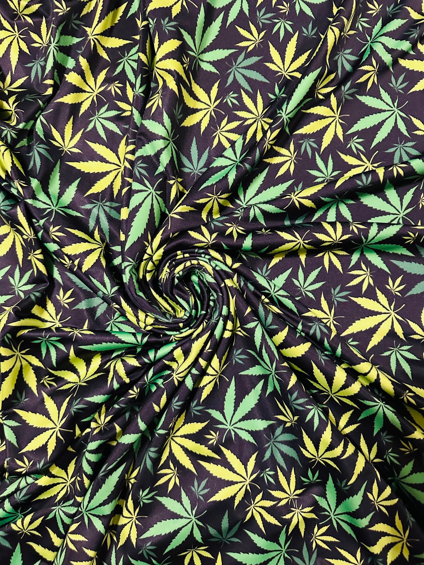 Marihuana leaf design Green/Yellow print on great quality of nylon spandex 4-way stretch 58/60” Sold by the YD. Ships worldwide from L.A