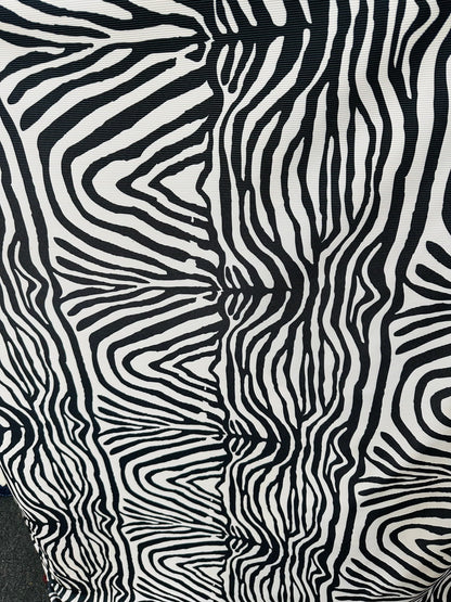 New Exotic zebra design print on great quality of ribbed nylon spandex 4-way stretch 58/60” Sold by the YD. Ships worldwide from L.A CA
