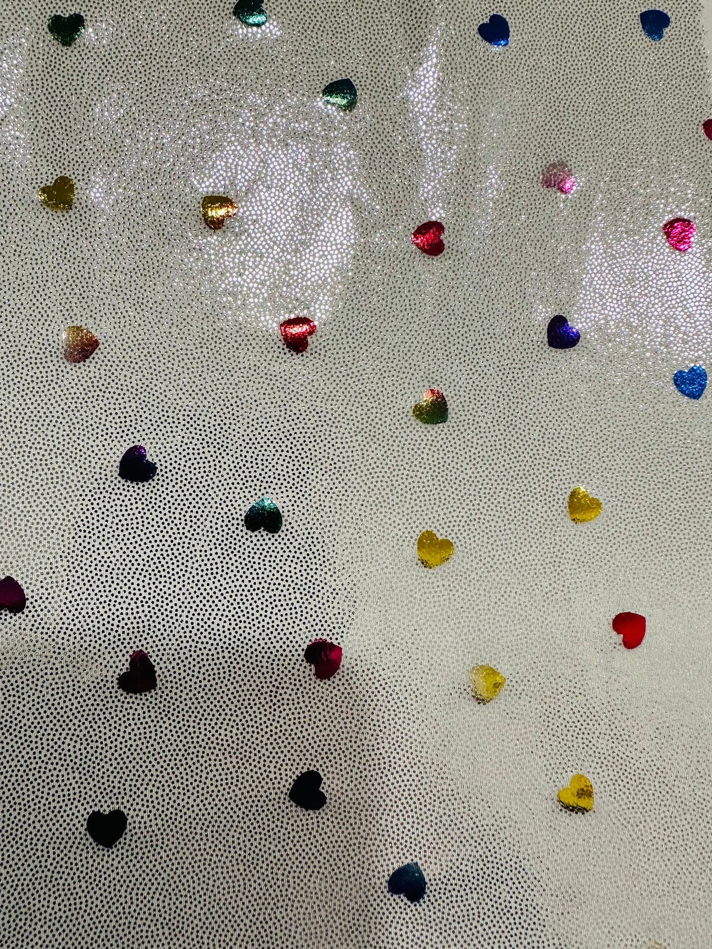 Hearts design metallic hologram nylon spandex W/Silver multicolor 4-way stretch spandex 58/60” Sold by the YD. Ships worldwide from L.A