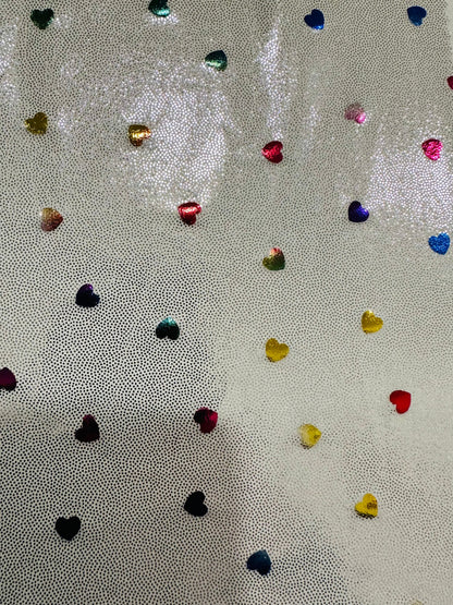 Hearts design metallic hologram nylon spandex W/Silver multicolor 4-way stretch spandex 58/60” Sold by the YD. Ships worldwide from L.A